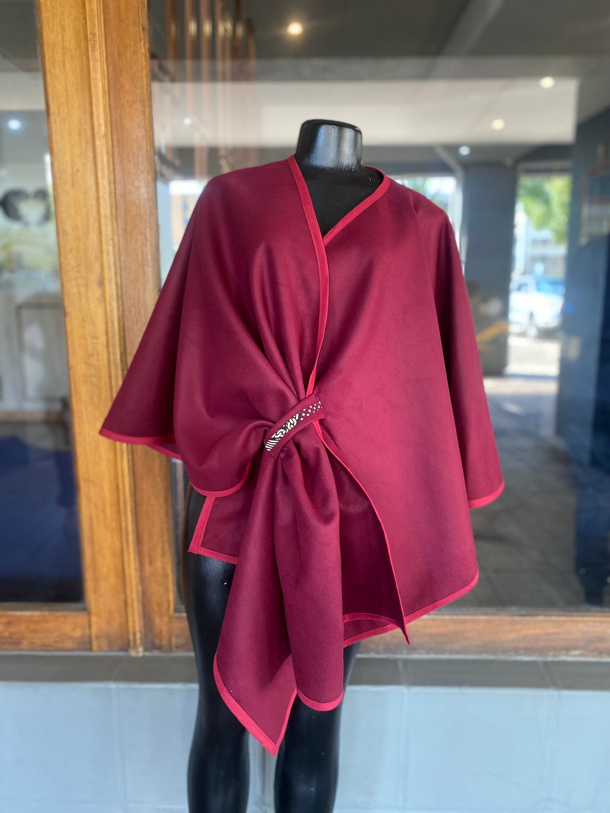 Draped Cape With Embellished Closure